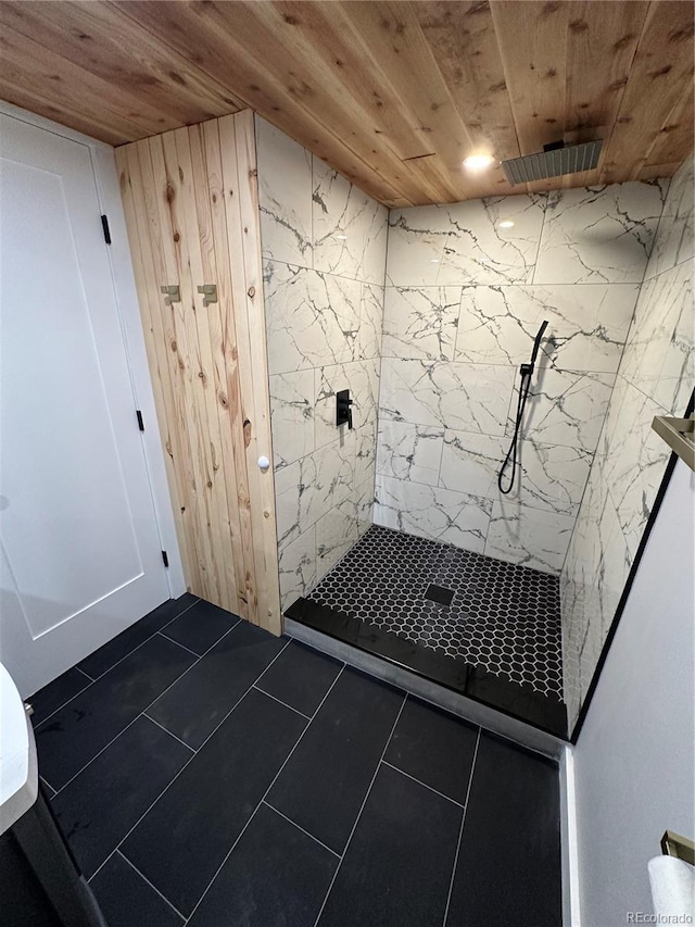 2201 Lima St, Aurora, CO 80010 - bathroom with wooden ceiling, tile patterned flooring, and a tile shower