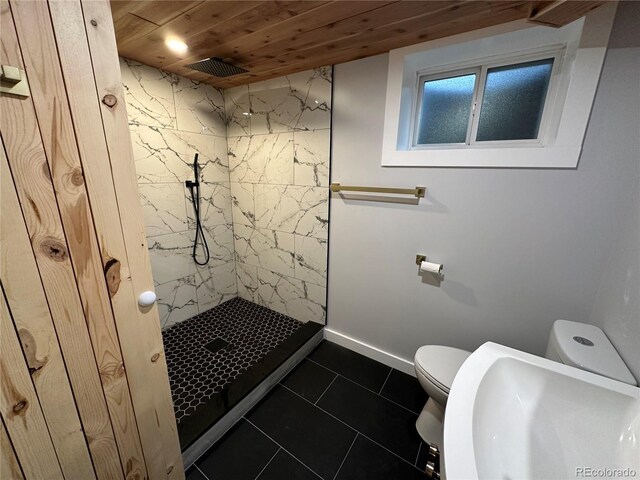 2201 Lima St, Aurora, CO 80010 - full bath with toilet, visible vents, tile patterned floors, wooden ceiling, and tiled shower