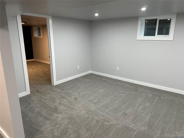 2201 Lima St, Aurora, CO 80010 - finished below grade area featuring dark colored carpet, baseboards, and recessed lighting