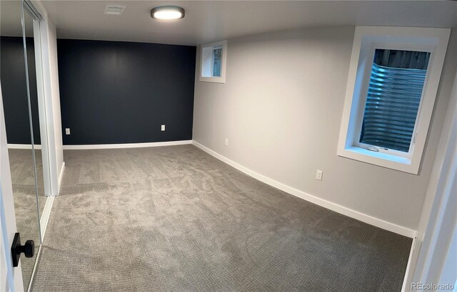 2201 Lima St, Aurora, CO 80010 - finished basement with baseboards, carpet flooring, and visible vents