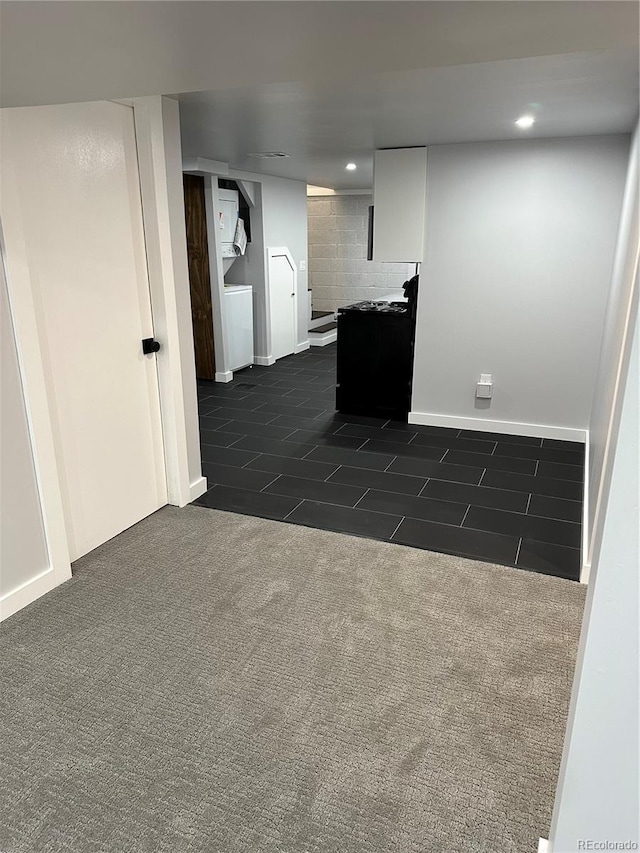 2201 Lima St, Aurora, CO 80010 - interior space featuring baseboards, dark tile patterned flooring, dark colored carpet, and recessed lighting