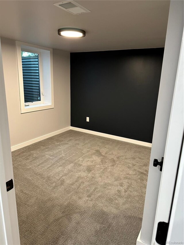 2201 Lima St, Aurora, CO 80010 - spare room featuring baseboards, carpet flooring, and visible vents