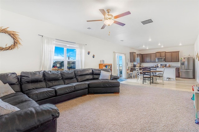 living area featuring light wood-style floors, recessed lighting, visible vents, and ceiling fan