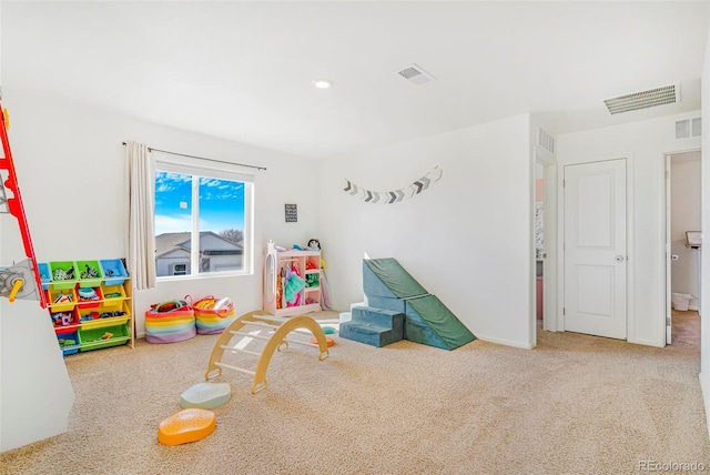 rec room with visible vents and carpet flooring