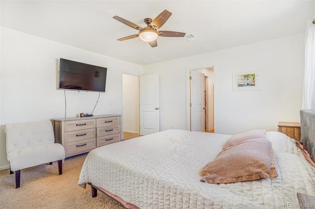 bedroom featuring a ceiling fan, light carpet, and visible vents