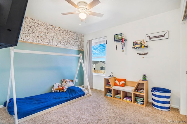 carpeted bedroom with a ceiling fan