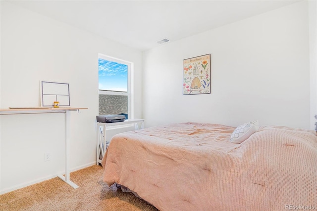 bedroom featuring carpet floors, visible vents, and baseboards