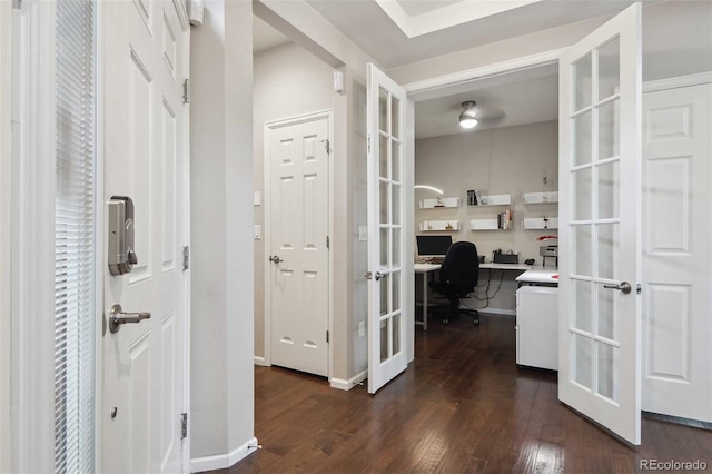 corridor with french doors and dark wood finished floors