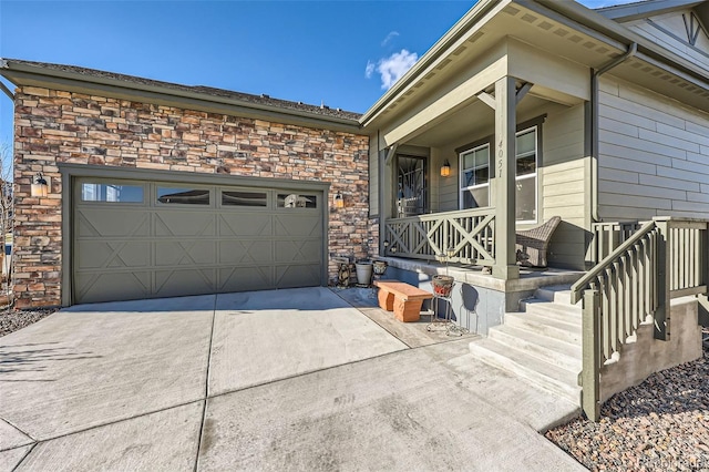 entrance to property with covered porch and a garage