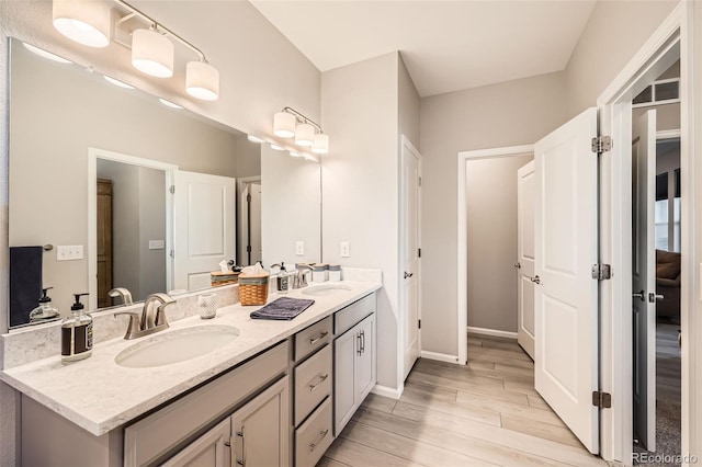 bathroom featuring vanity and hardwood / wood-style flooring