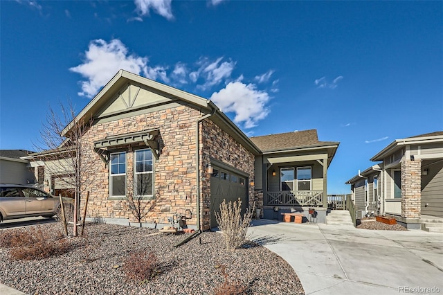 view of front of property with a porch and a garage