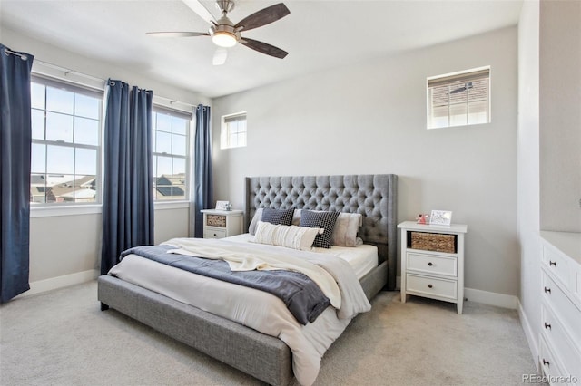 bedroom with light colored carpet and ceiling fan