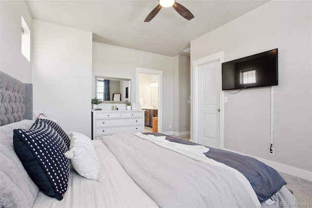 bedroom featuring carpet floors, ceiling fan, and ensuite bath