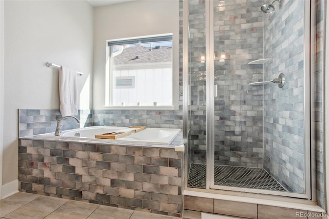 bathroom featuring tile patterned flooring and separate shower and tub