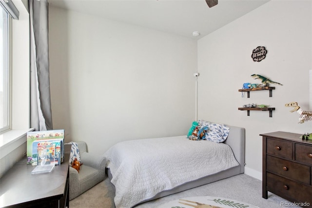 carpeted bedroom with ceiling fan