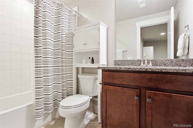 full bathroom featuring vanity, shower / tub combo, and toilet