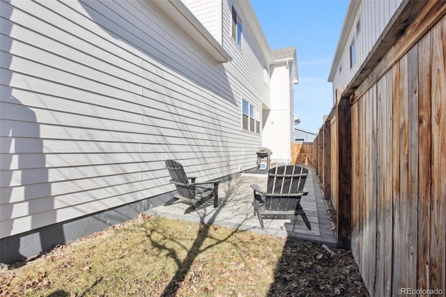 view of side of property with a patio area