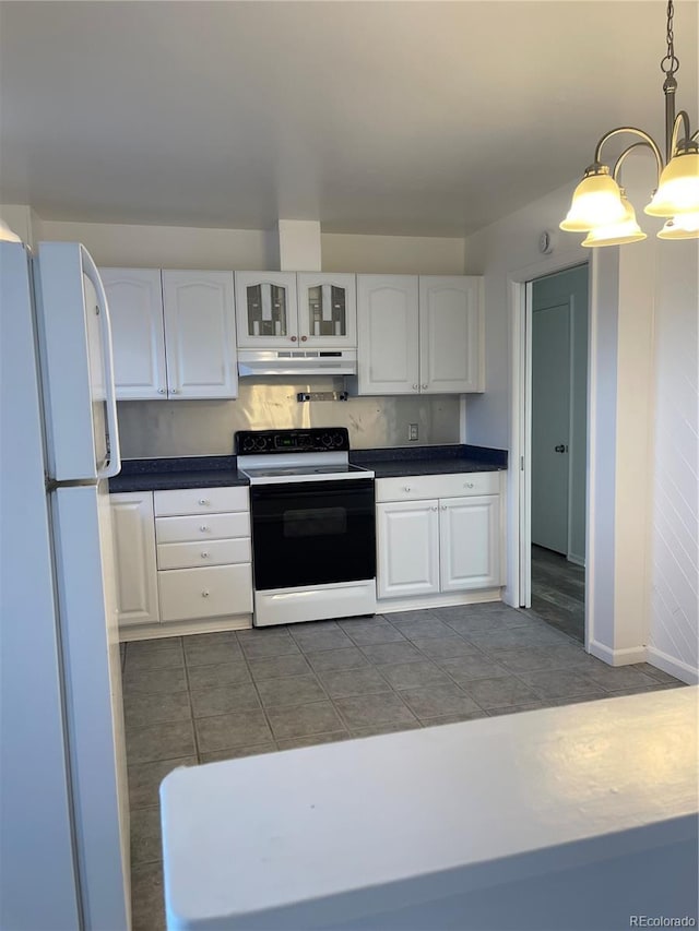 kitchen with under cabinet range hood, white cabinetry, electric stove, and freestanding refrigerator