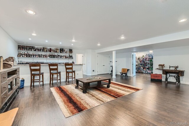 recreation room featuring dark wood-type flooring