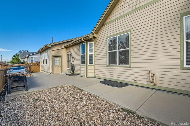 back of house with a patio