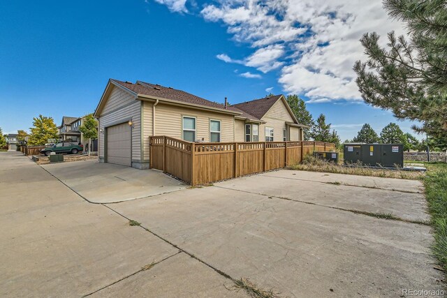 view of side of home with a garage