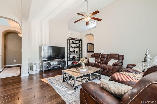 living room with dark wood-type flooring, high vaulted ceiling, and ceiling fan