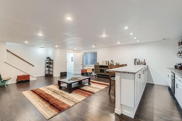 living room featuring dark hardwood / wood-style flooring