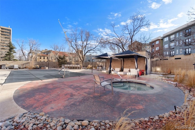 view of swimming pool featuring a gazebo, a hot tub, and a patio