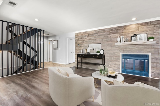 living room featuring wood-type flooring and a fireplace