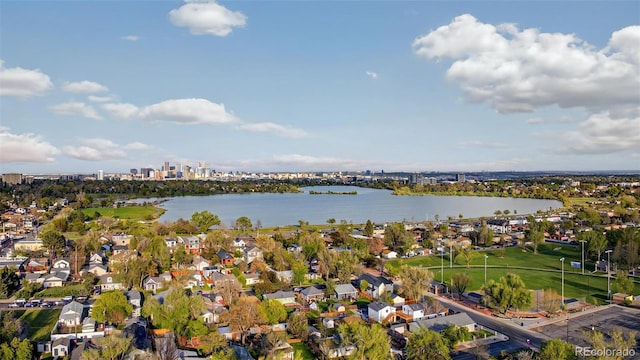 aerial view of residential area with a large body of water