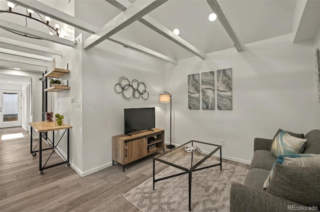 living room featuring wood finished floors, baseboards, and recessed lighting