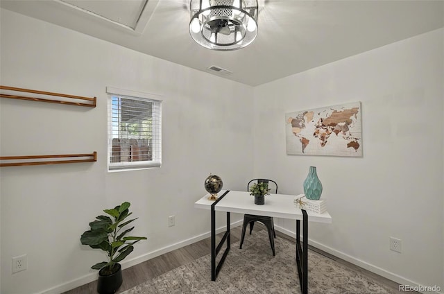 home office with wood finished floors and baseboards
