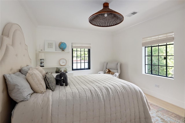 5800 E 6th Avenue Parkway, Denver, CO 80220 - bedroom with wood finished floors and crown molding