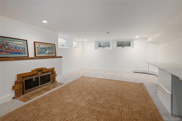 5800 E 6th Avenue Parkway, Denver, CO 80220 - finished below grade area featuring a baseboard heating unit, light carpet, a tiled fireplace, and recessed lighting