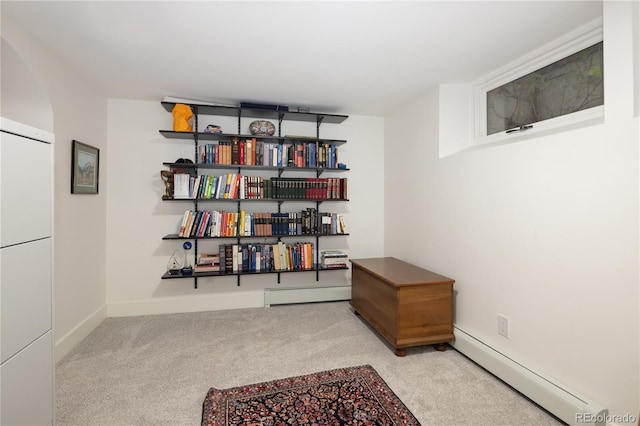 5800 E 6th Avenue Parkway, Denver, CO 80220 - living area featuring baseboard heating, carpet floors, and arched walkways