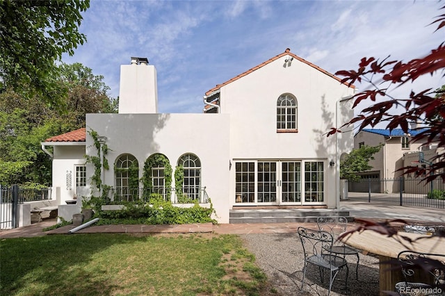 5800 E 6th Avenue Parkway, Denver, CO 80220 - rear view of property with a chimney, french doors, stucco siding, a patio area, and a tiled roof