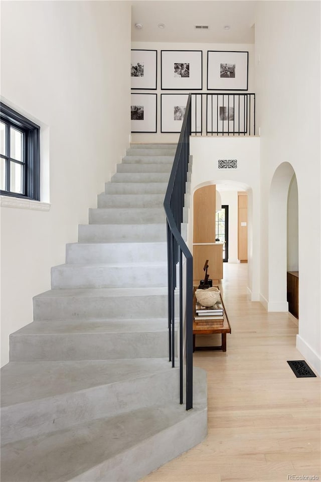 5800 E 6th Avenue Parkway, Denver, CO 80220 - staircase featuring arched walkways and wood finished floors