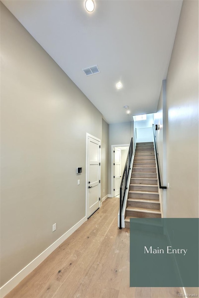 stairway featuring hardwood / wood-style floors