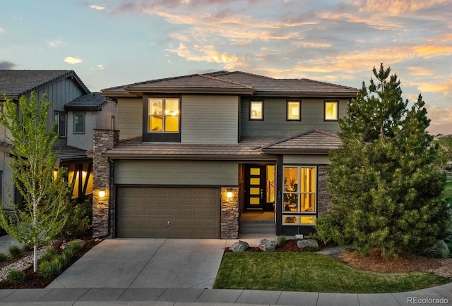 481 Meadowleaf Ln, Highlands Ranch, CO 80126 - view of front facade with stone siding, a garage, concrete driveway, and a front yard