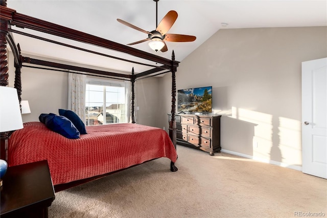 carpeted bedroom with vaulted ceiling and ceiling fan