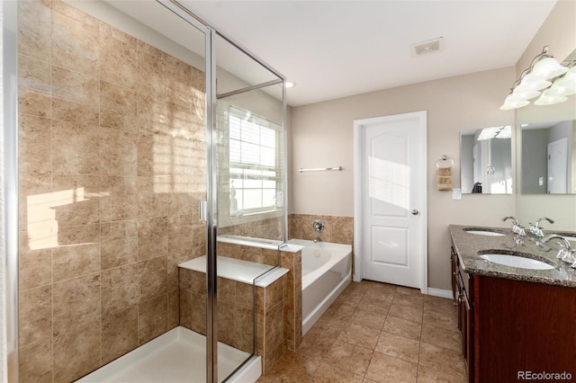 full bathroom featuring a garden tub, a sink, visible vents, tile patterned floors, and a stall shower