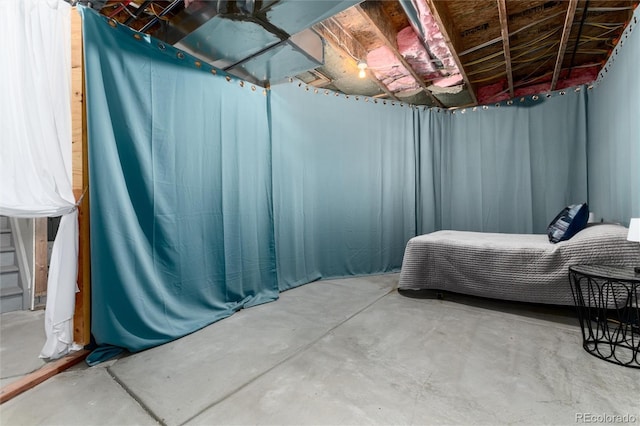 bedroom featuring concrete floors