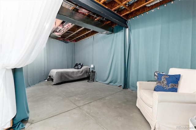 bedroom featuring concrete floors