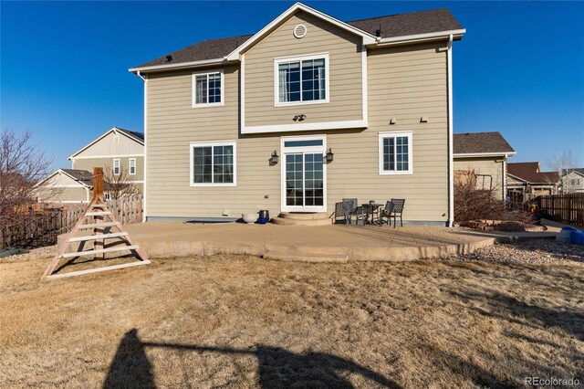 back of house featuring a patio area and fence