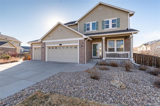 view of front of home featuring a garage, covered porch, brick siding, and driveway