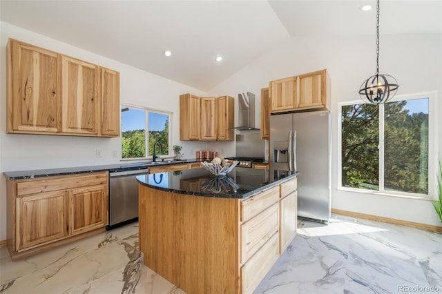 kitchen with appliances with stainless steel finishes, wall chimney exhaust hood, light marble finish flooring, lofted ceiling, and a sink