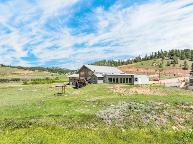 view of green lawn with a view of rural / pastoral area