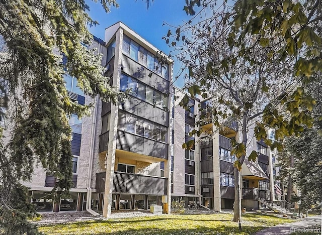 view of property featuring central AC unit