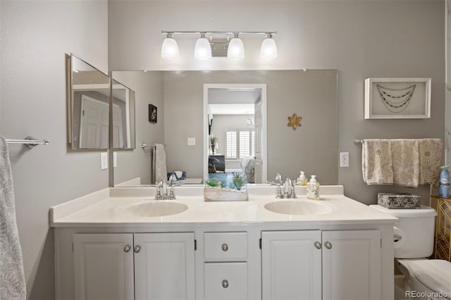 bathroom with vanity and toilet