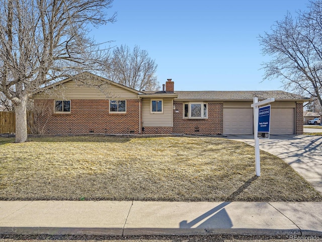 single story home with an attached garage, driveway, a chimney, and brick siding